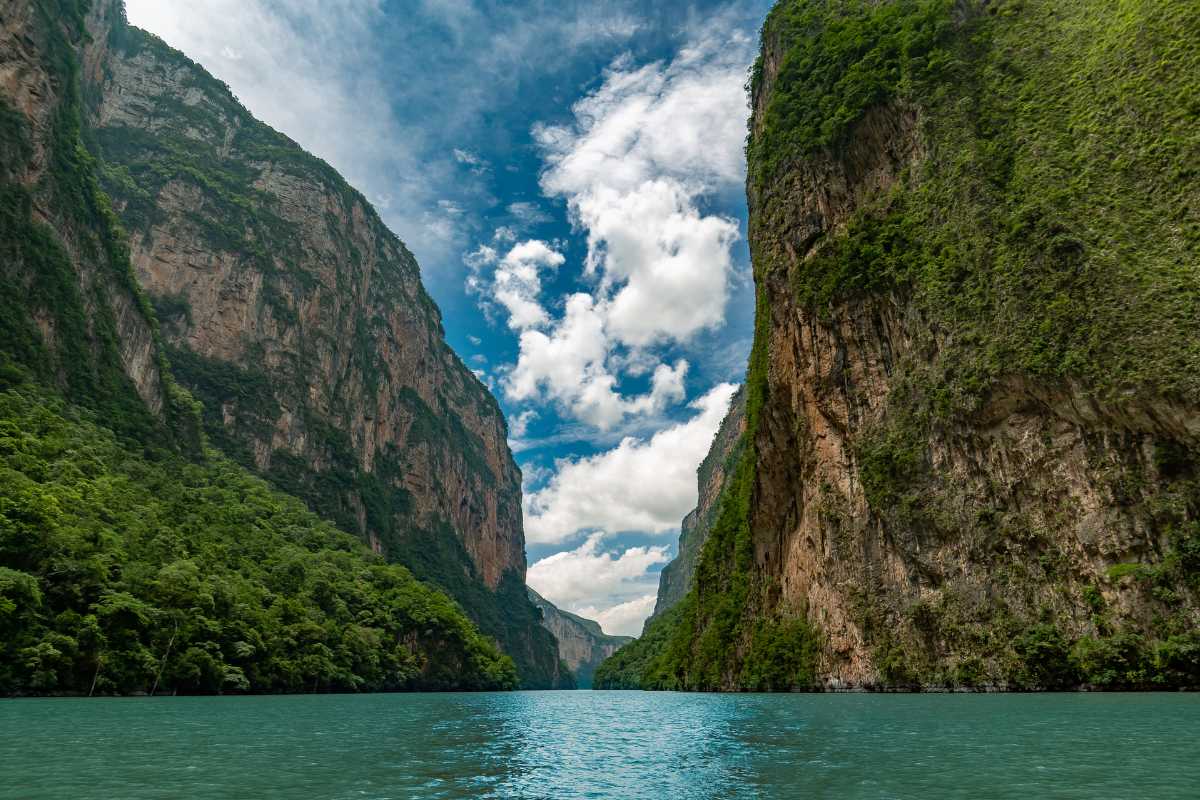 Two big green mountains with river between them